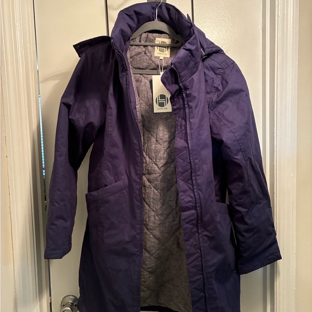 Navy Blue Quilted Lined Coat, NWT and dust bag. Adjustable hood is fur trimmed